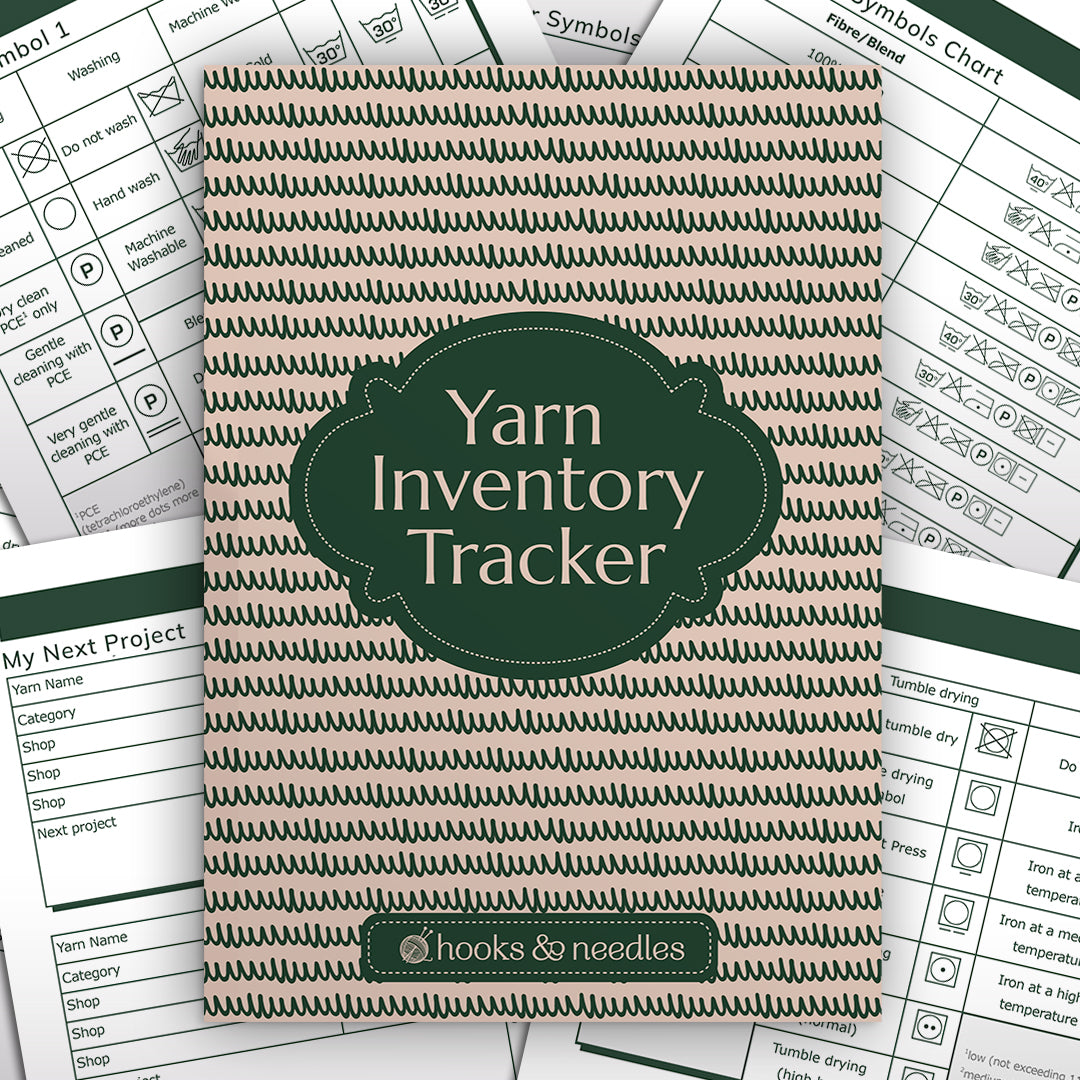 A green and beige Yarn Inventory Tracker lies on top of several sheets with different knitting and crochet symbols and project planning charts.